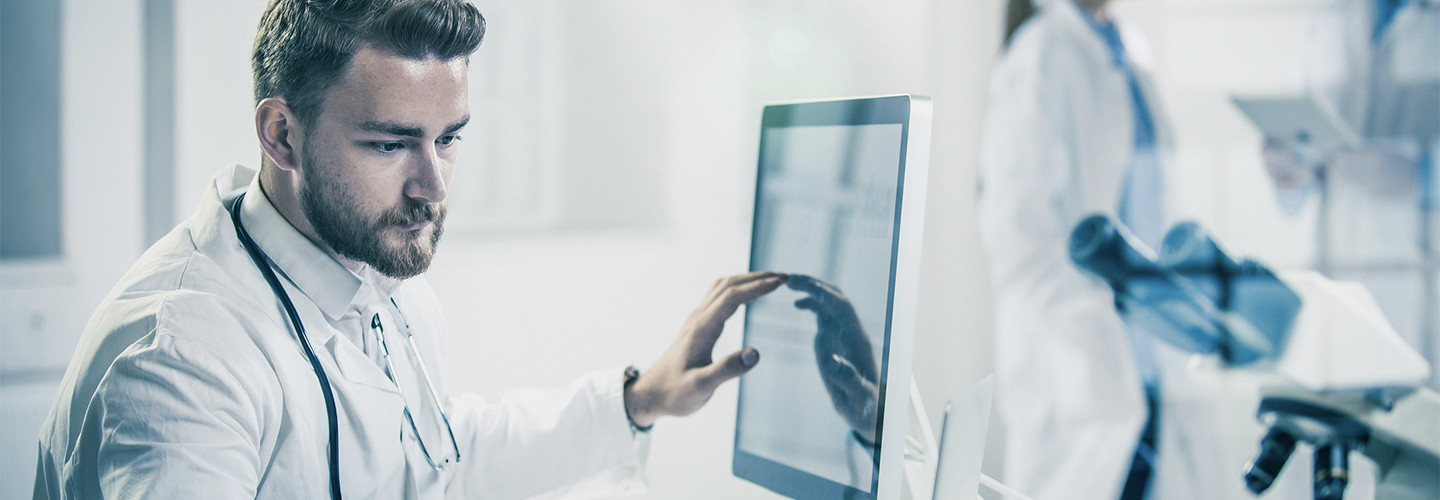 Doctor using computer in hospital
