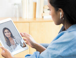 Woman has telehealth consultation with her doctor