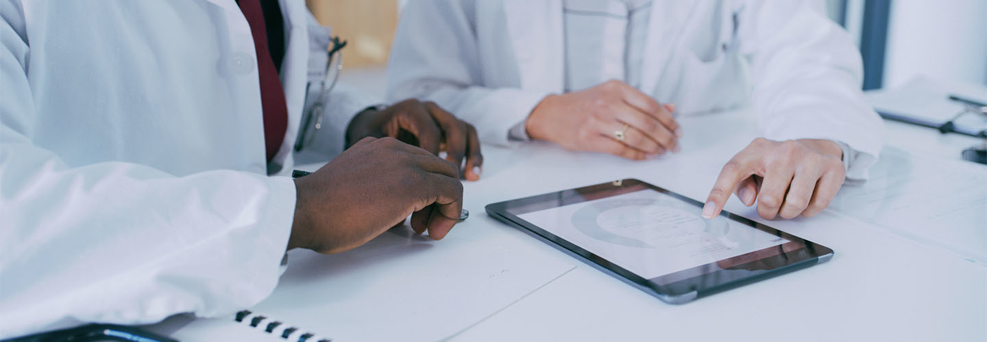 Two doctors discussing patient care