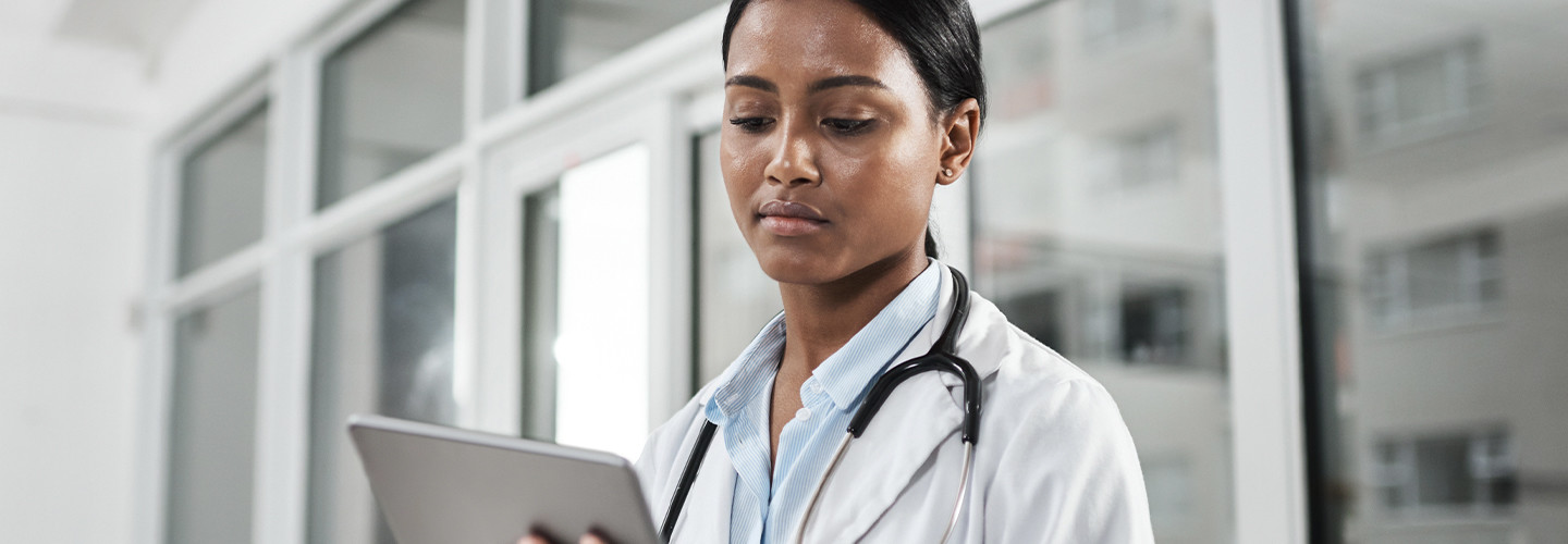 Doctor using mobile device