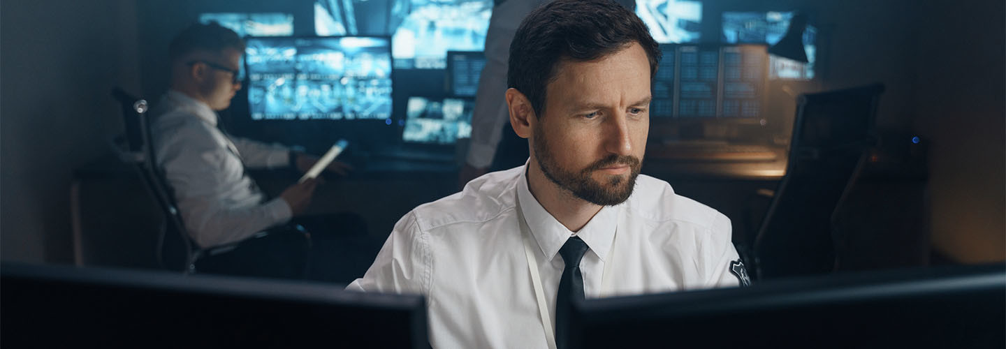 Security guard observing screens