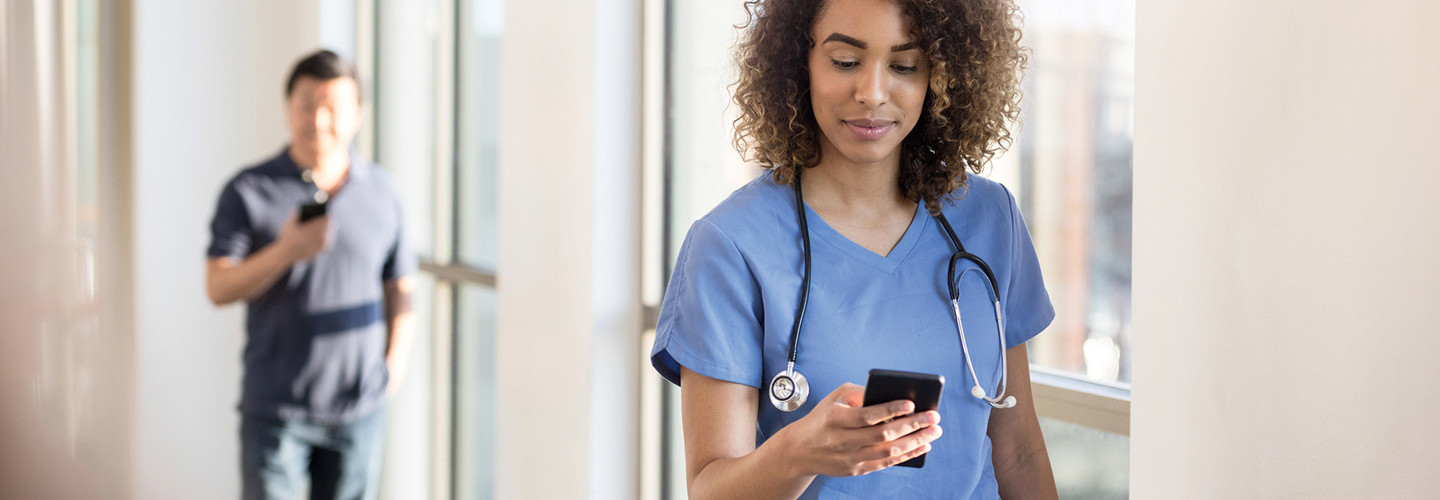 clinician on her smart phone