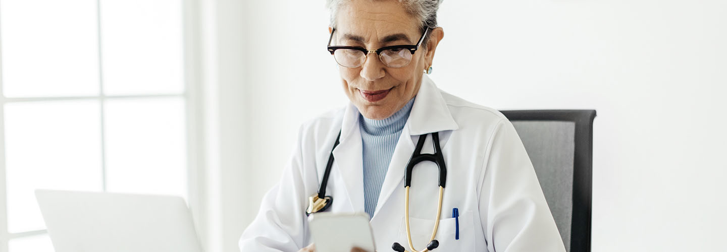 Doctor using mobile devices